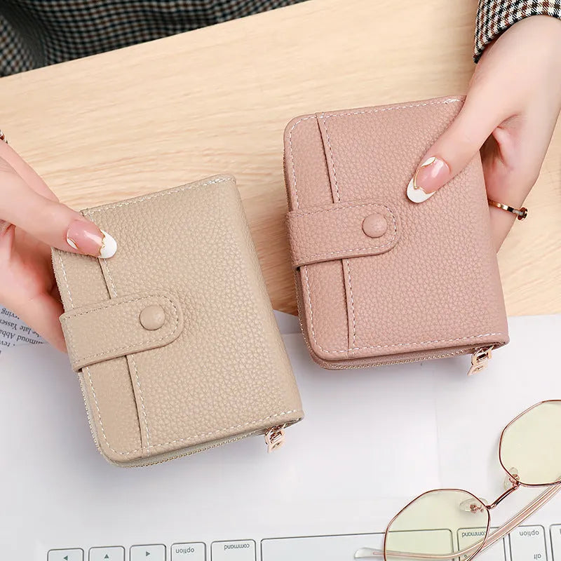 Lychee pattern textured ladies' two-fold short wallet in beige, pink, black, and red colour options.