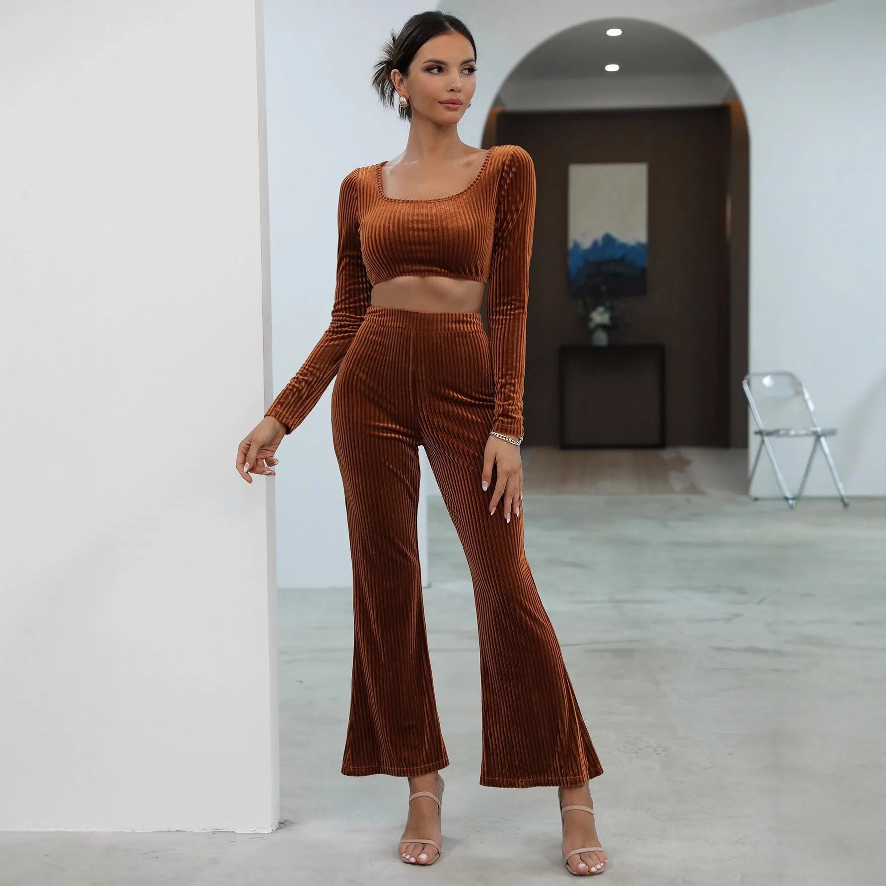 Caramel-coloured long sleeve sweater set with matching top and trousers on hanger