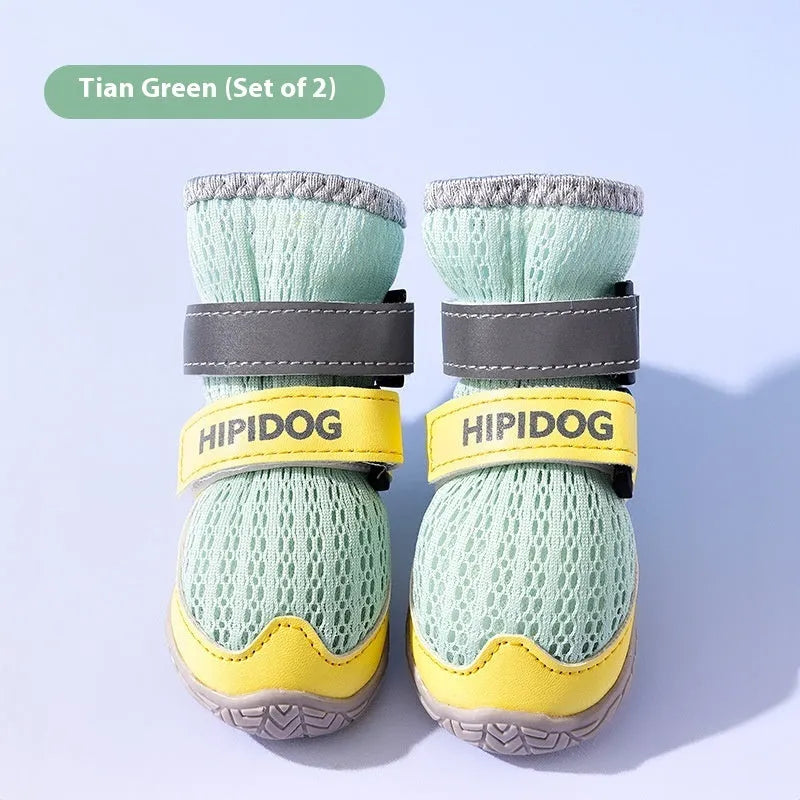Pair of blue cartoon-style dog shoes made from PU material for summer paw protection.