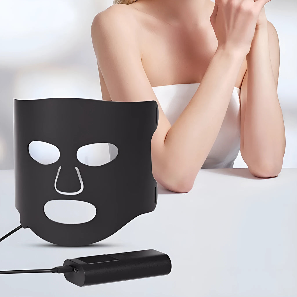 Black gold LED phototherapy face mask with controller showing seven colour light modes for skin treatment