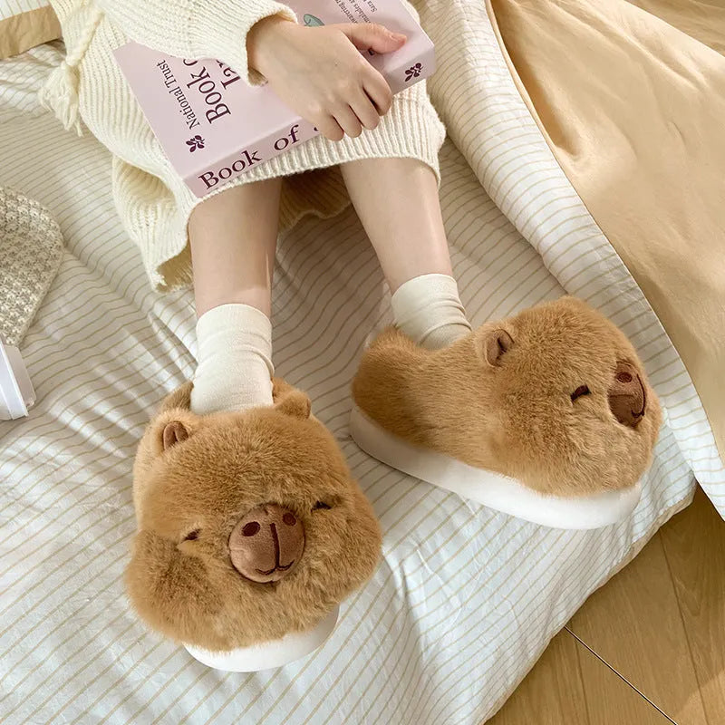 Light brown women's winter slippers with a cartoon pattern, plush upper, and round toe.