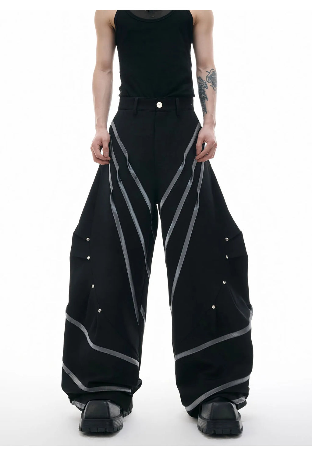 Men's polyester trousers with three-dimensional cutting, metal striped rivets, and pleated design