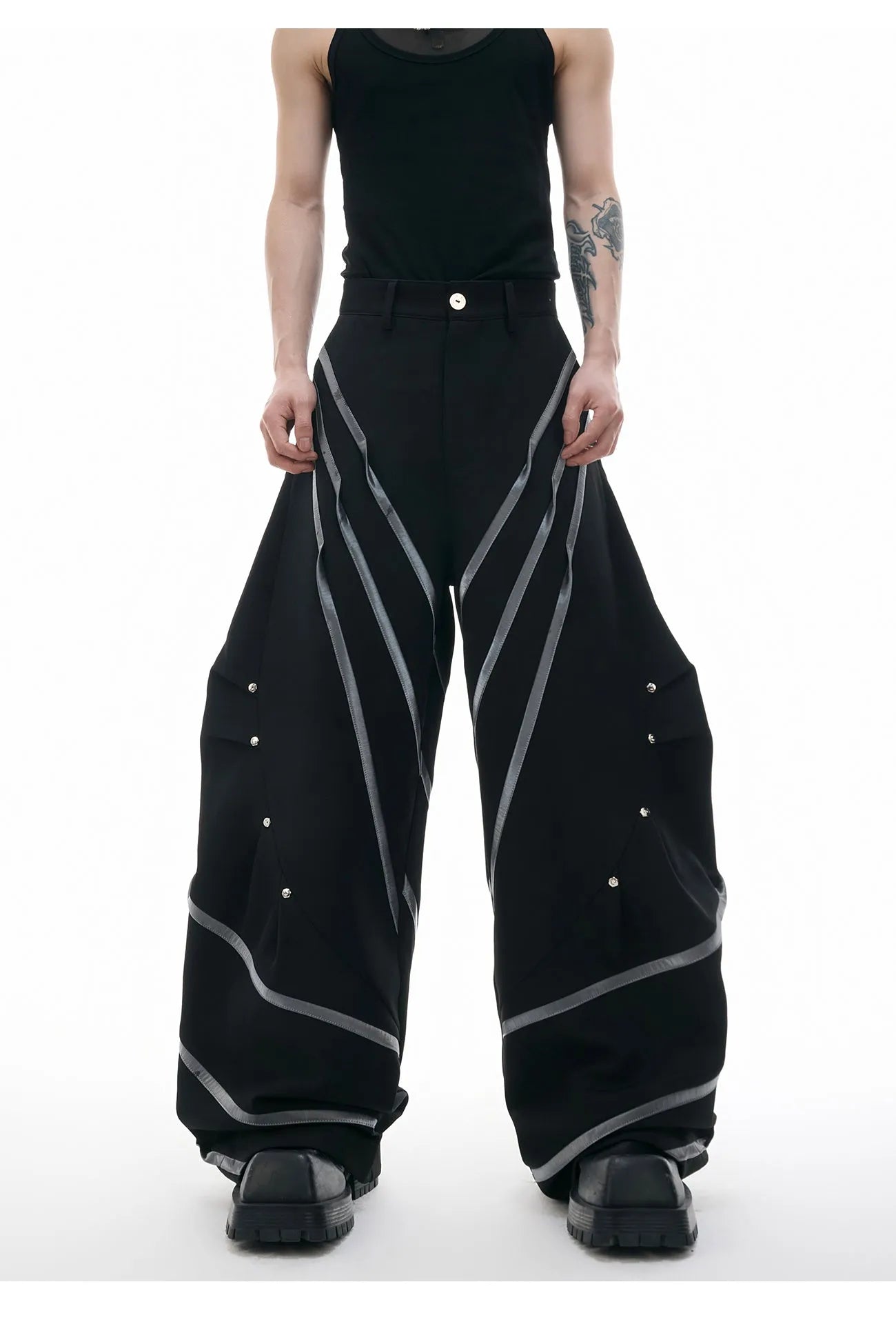 Men's polyester trousers with three-dimensional cutting, metal striped rivets, and pleated design