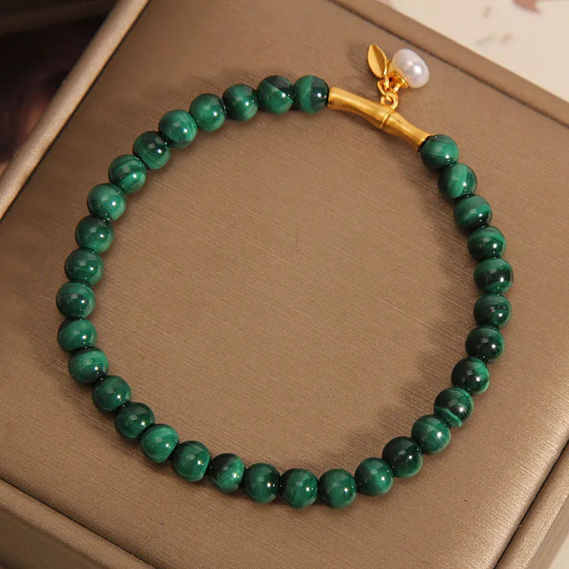 Women's adjustable white crystal bracelet with lucky bamboo charm in high-rise setting