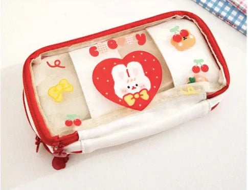 Japanese transparent heart pen bag with rabbit design showing pens inside