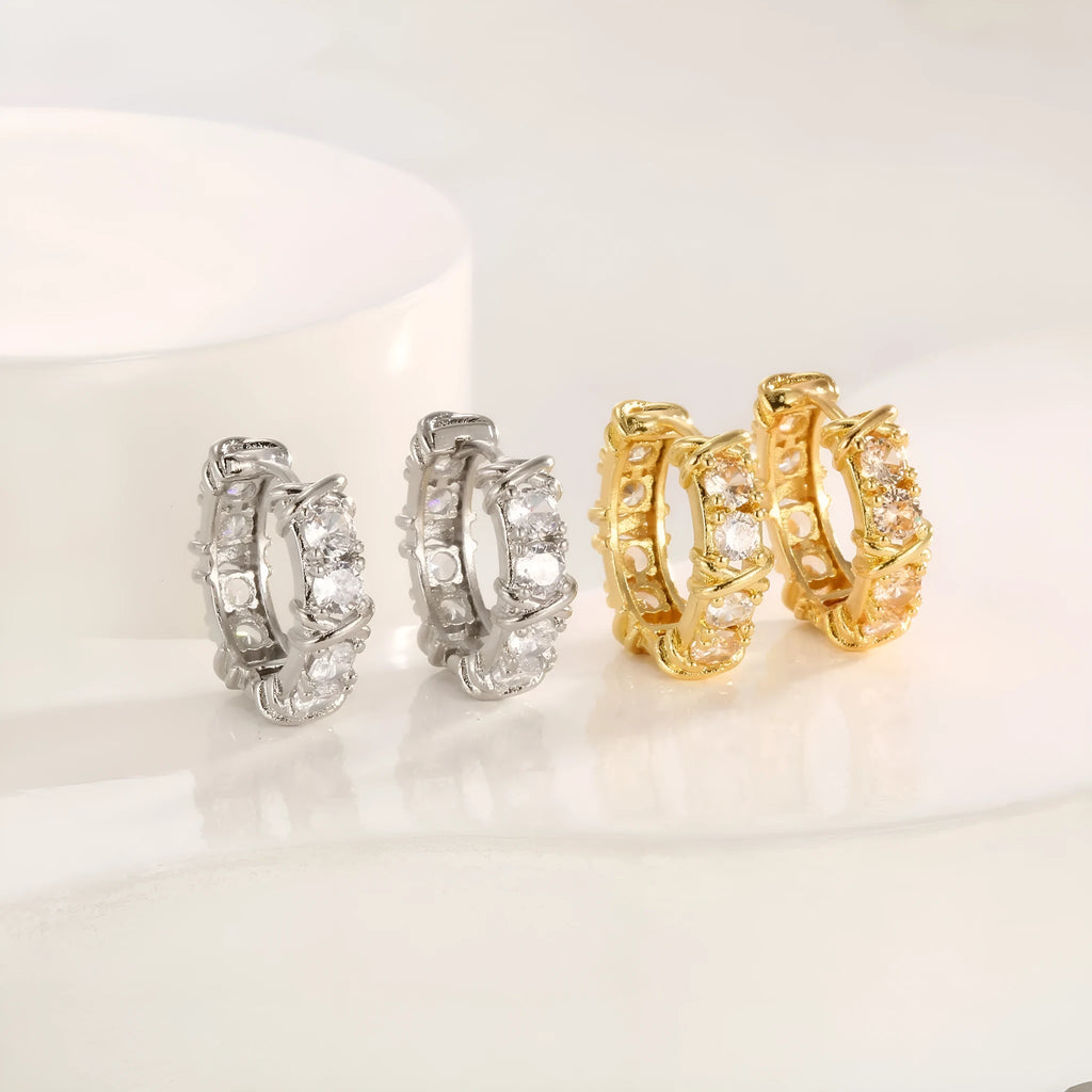 Geometric hexagonal earrings with clover cross design and elliptical accents in electroplated silver or gold finish