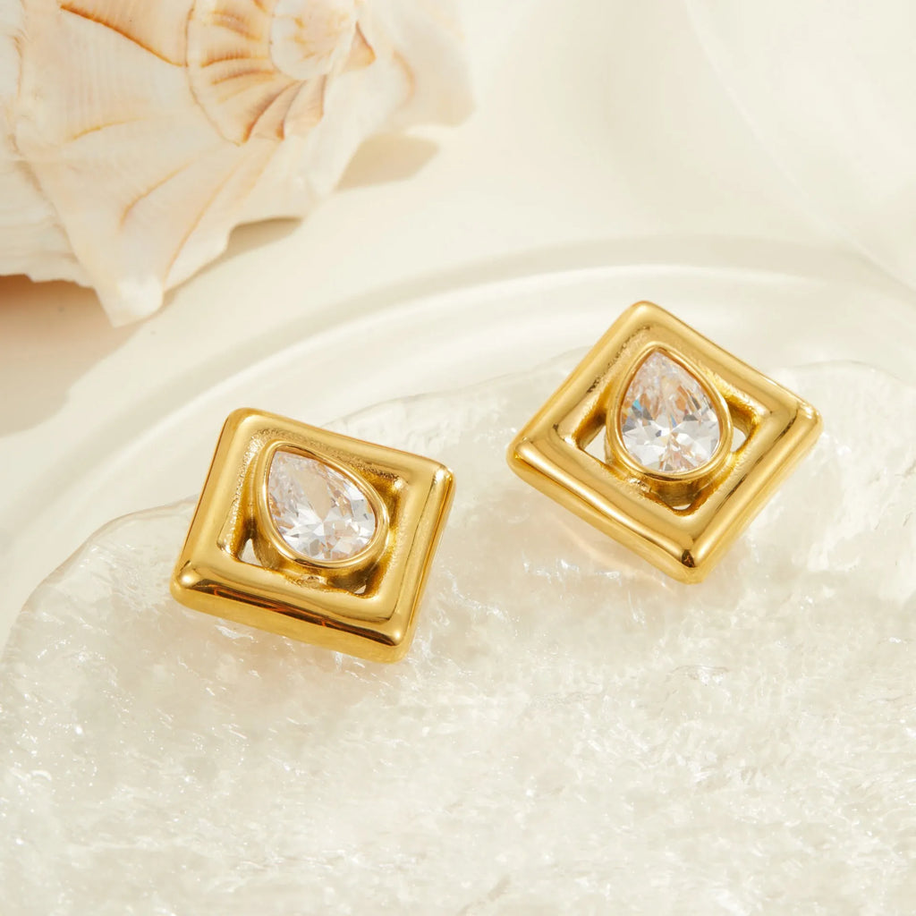 Gold-tone geometric stud earrings with inlaid water drop zircon stones on stainless steel