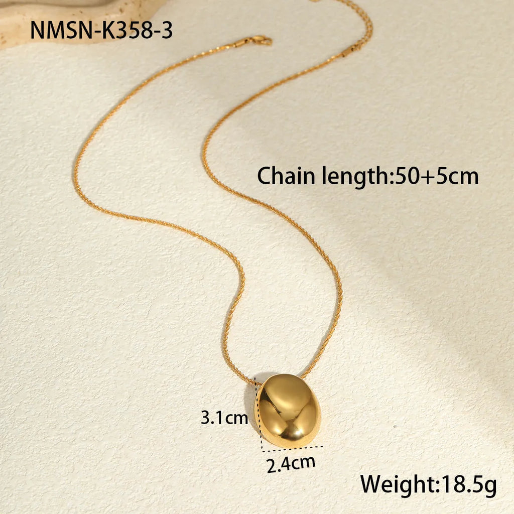 Geometric gold pendant on adjustable stainless steel chain necklace with regular links