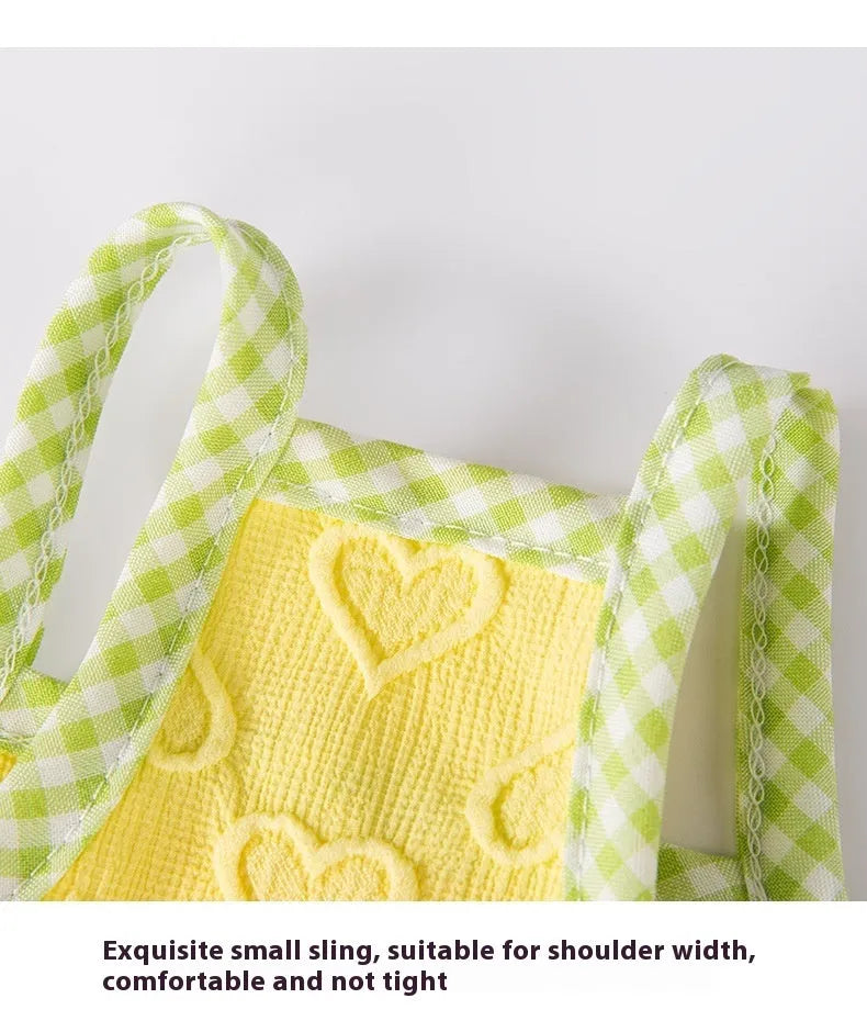 Small dog wearing heart texture bow suspenders vest in elastic material