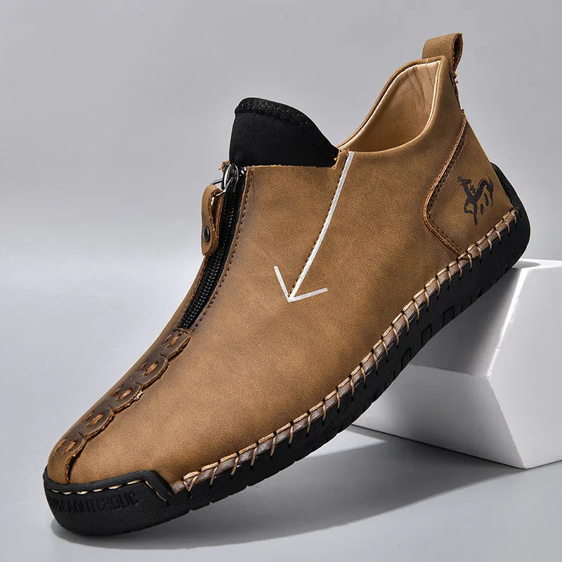 Men's black front-zipper casual leather-style boots with round toe and hand-stitched detail on a white background.