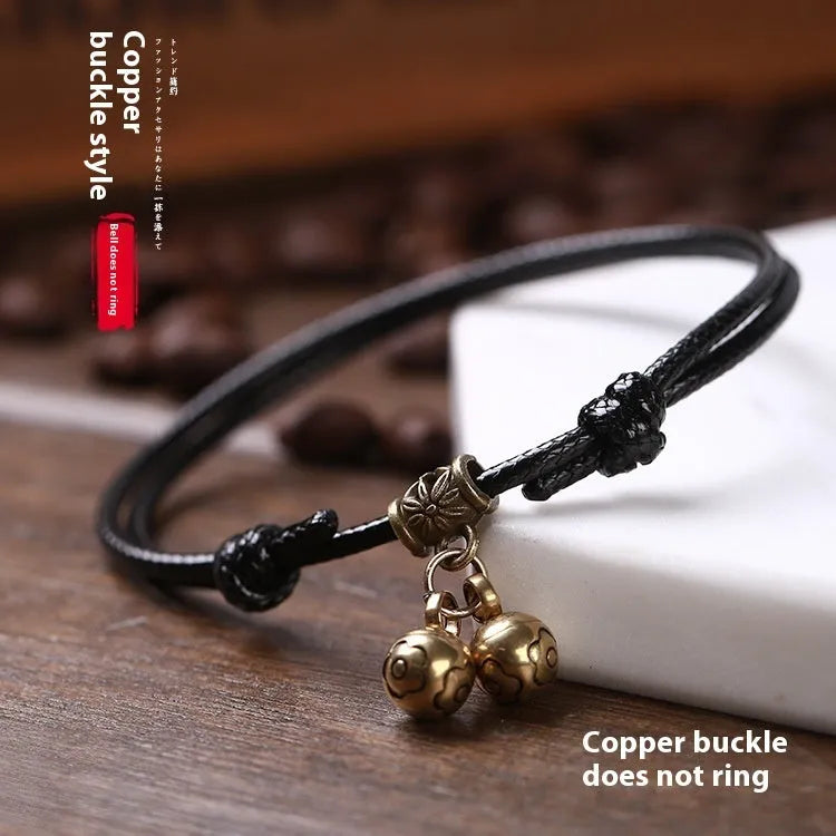 A nylon rope dog collar with a brass bell, shown in black, red, and coffee colour options.