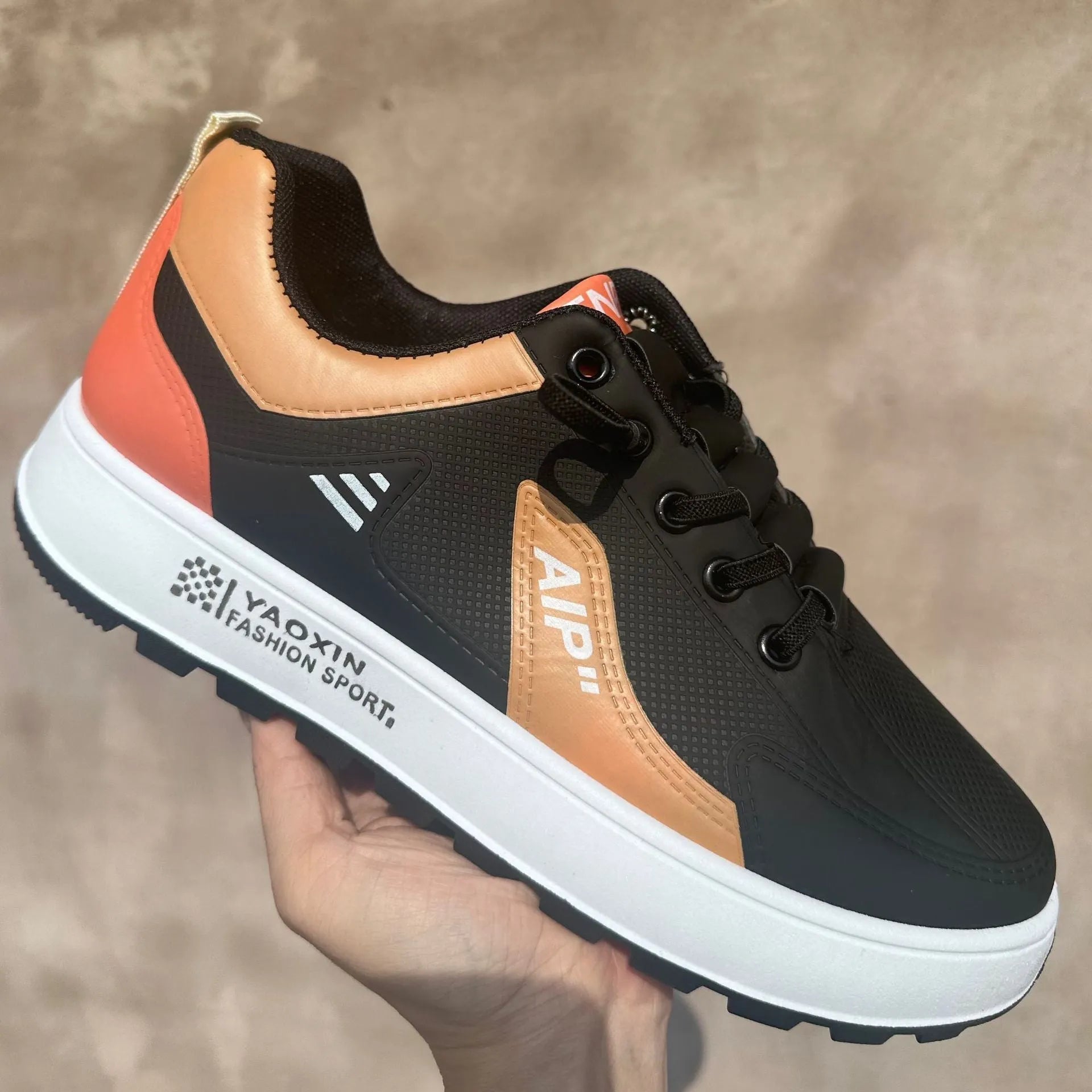 Men's casual shoes with round toe and artificial PU upper in white with orange, black or brown accents