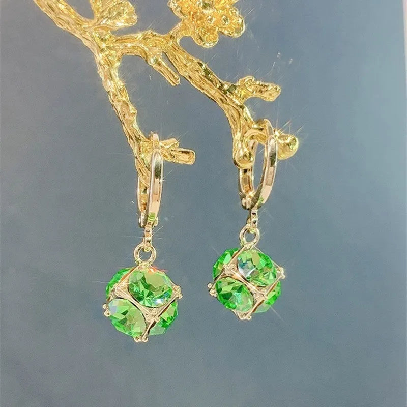 Women's copper geometric earrings with electroplated zircon finish in multiple colour variations