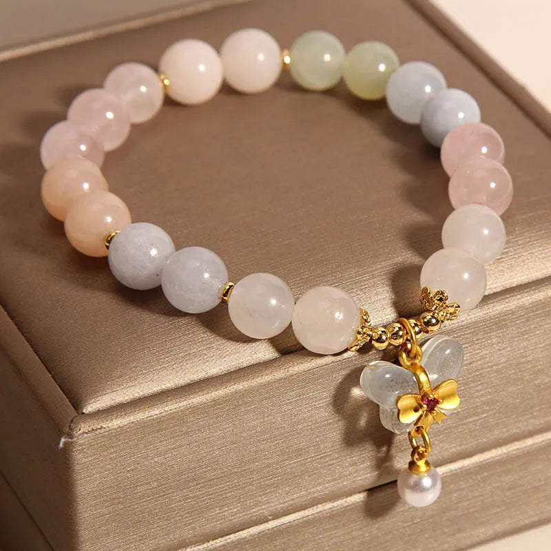 Women's crystal bracelet with natural Morganite butterfly pendant in colourful gemstone tones.