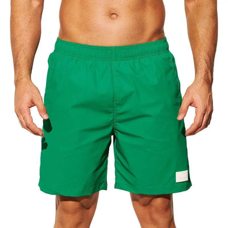 Men's quick-dry nylon sports shorts in blue with straight leg opening