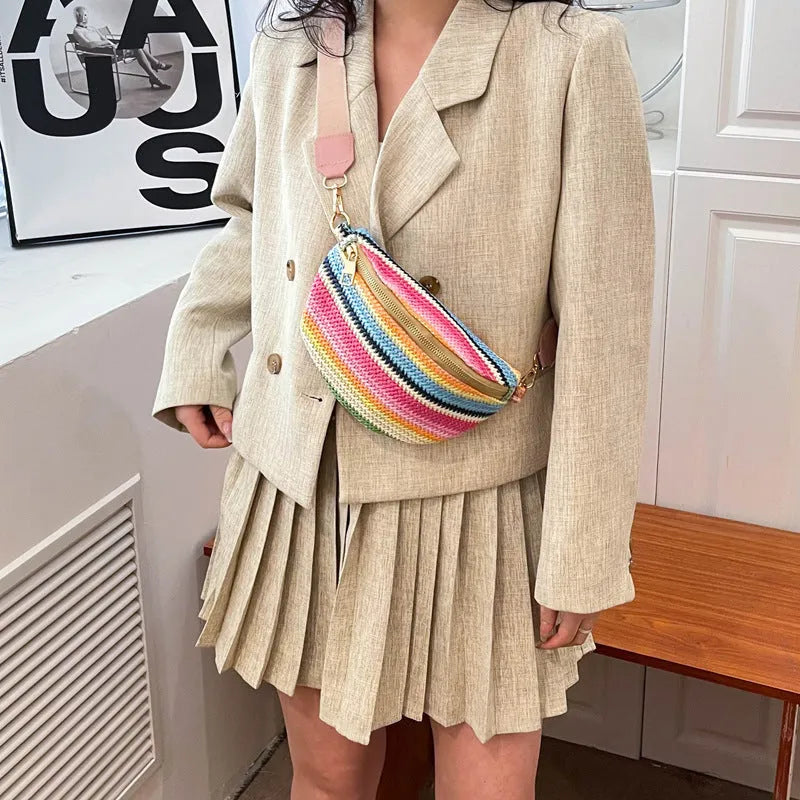Bohemian woven straw beach bag with single strap in pink or blue showing sandwich pocket and shell shape