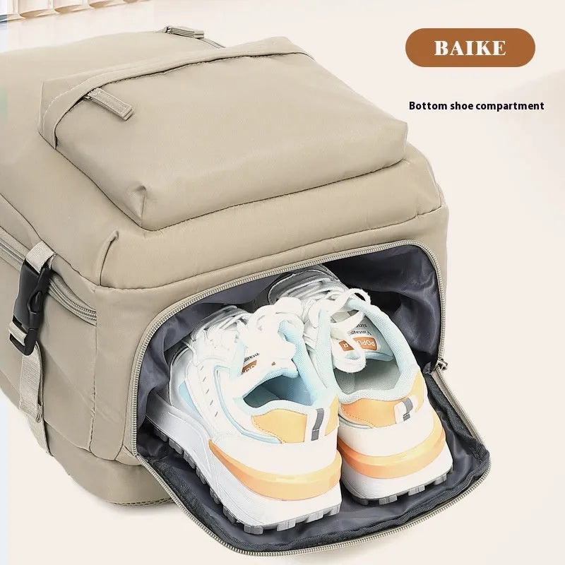 Large capacity women's travel backpack in light grey colour with curved shoulder straps