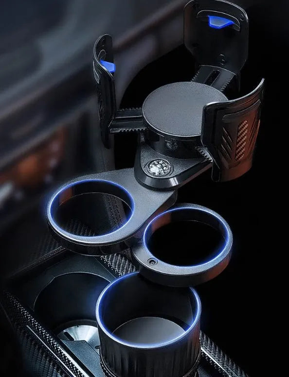 Retractable black car drink holder with adjustable base on a car dashboard.