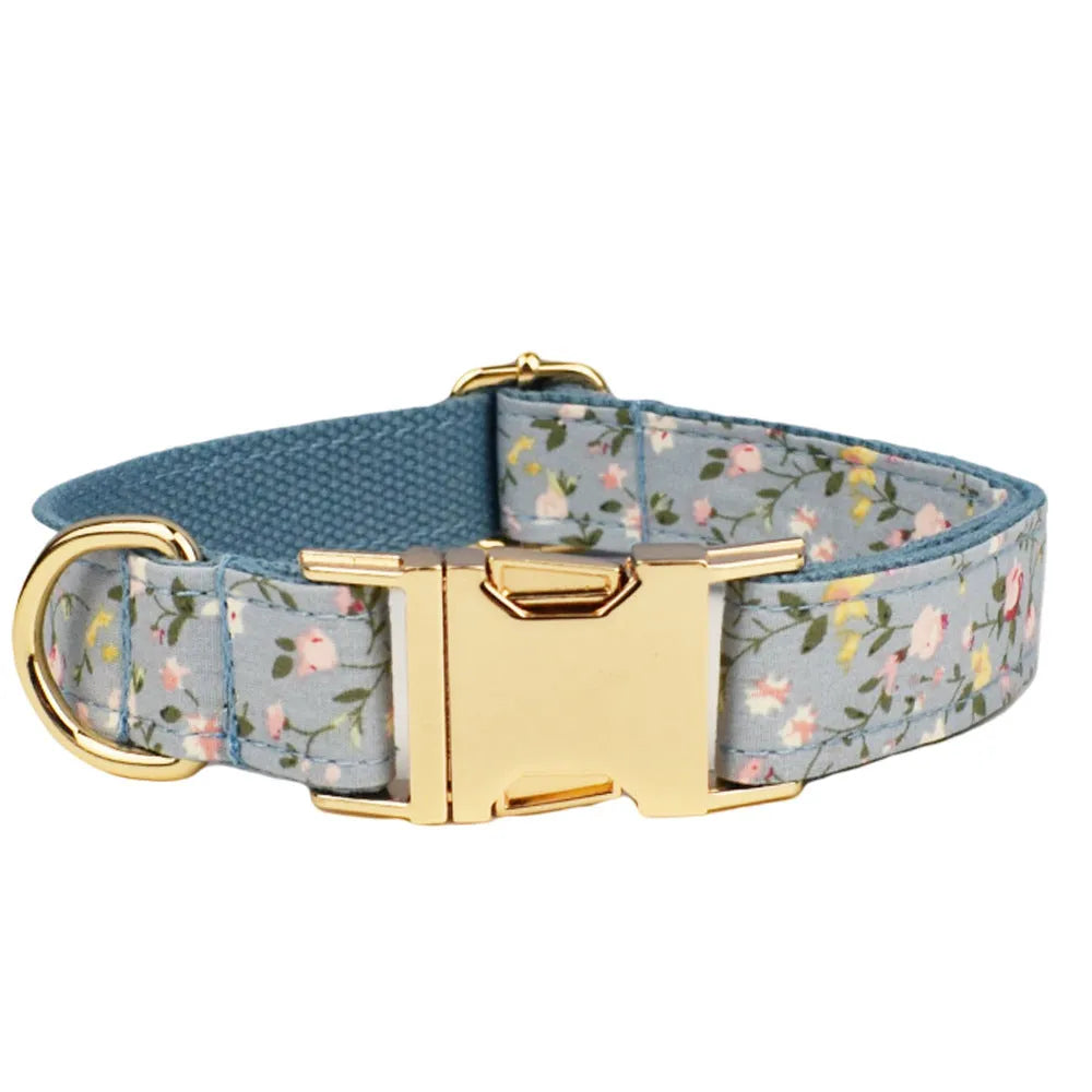 Blue floral pattern dog collar made from polyester cotton fabric with adjustable strap and decorative bow accessory.
