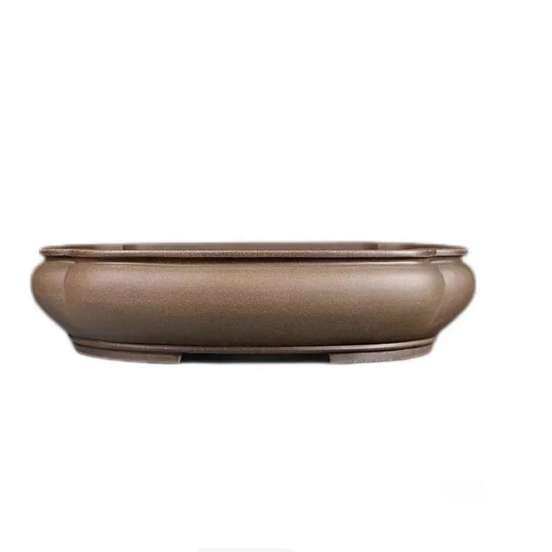 Handmade antique papaya-shaped purple clay flower pot, 46cm long, on a wooden surface.
