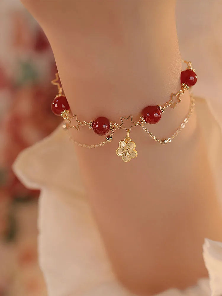 A red agate double layer bracelet with floral details for women.