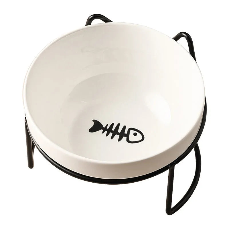 White ceramic cat bowl with cat paw print in a black iron frame stand with cat ears