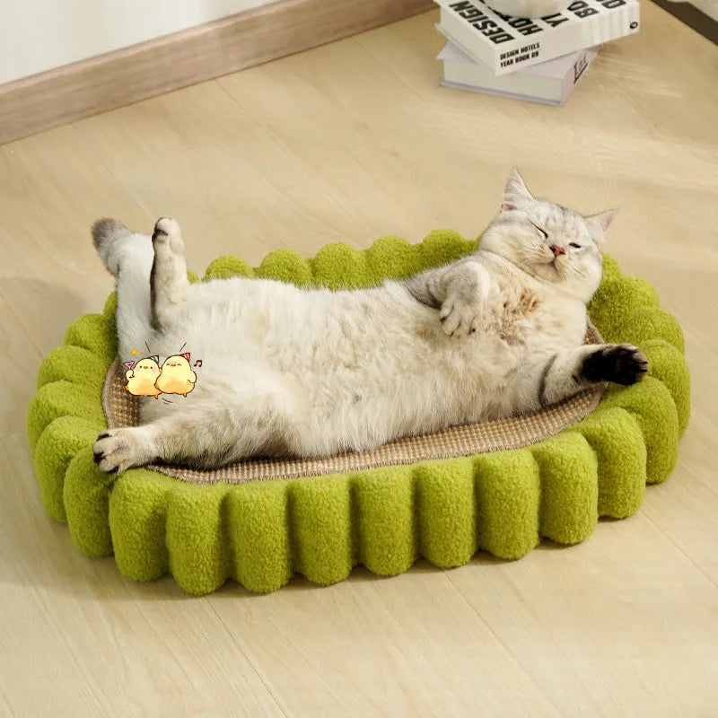 Green oval-shaped cat scratcher pad made of sisal, functioning as both a scratching surface and a lounge bed for cats.