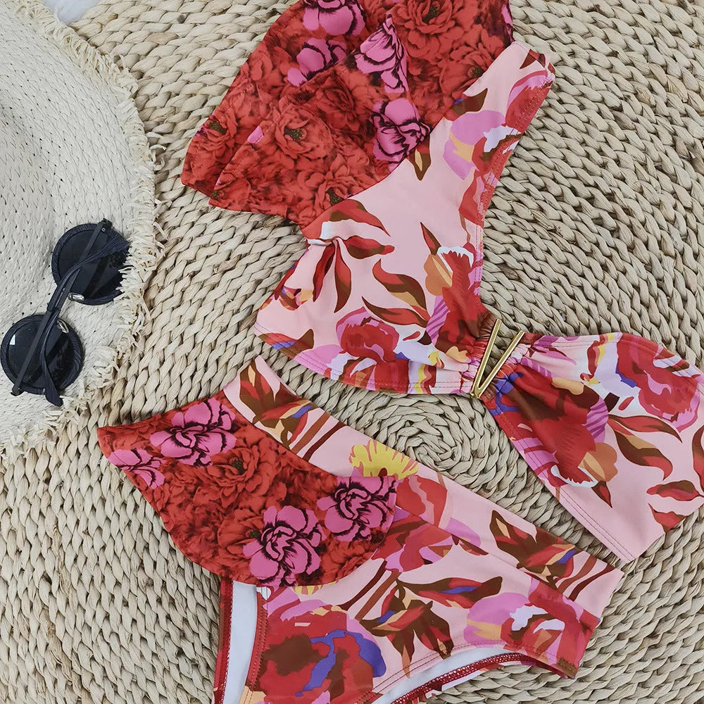 Women's pink floral print one-shoulder bikini with ruffled detail and high-waist briefs