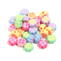 Frosted acrylic four-leaf clover shaped beads in mixed colours on white background
