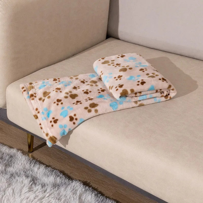 Blue cartoon dog print double-sided thickened flannel pet blanket laid flat.