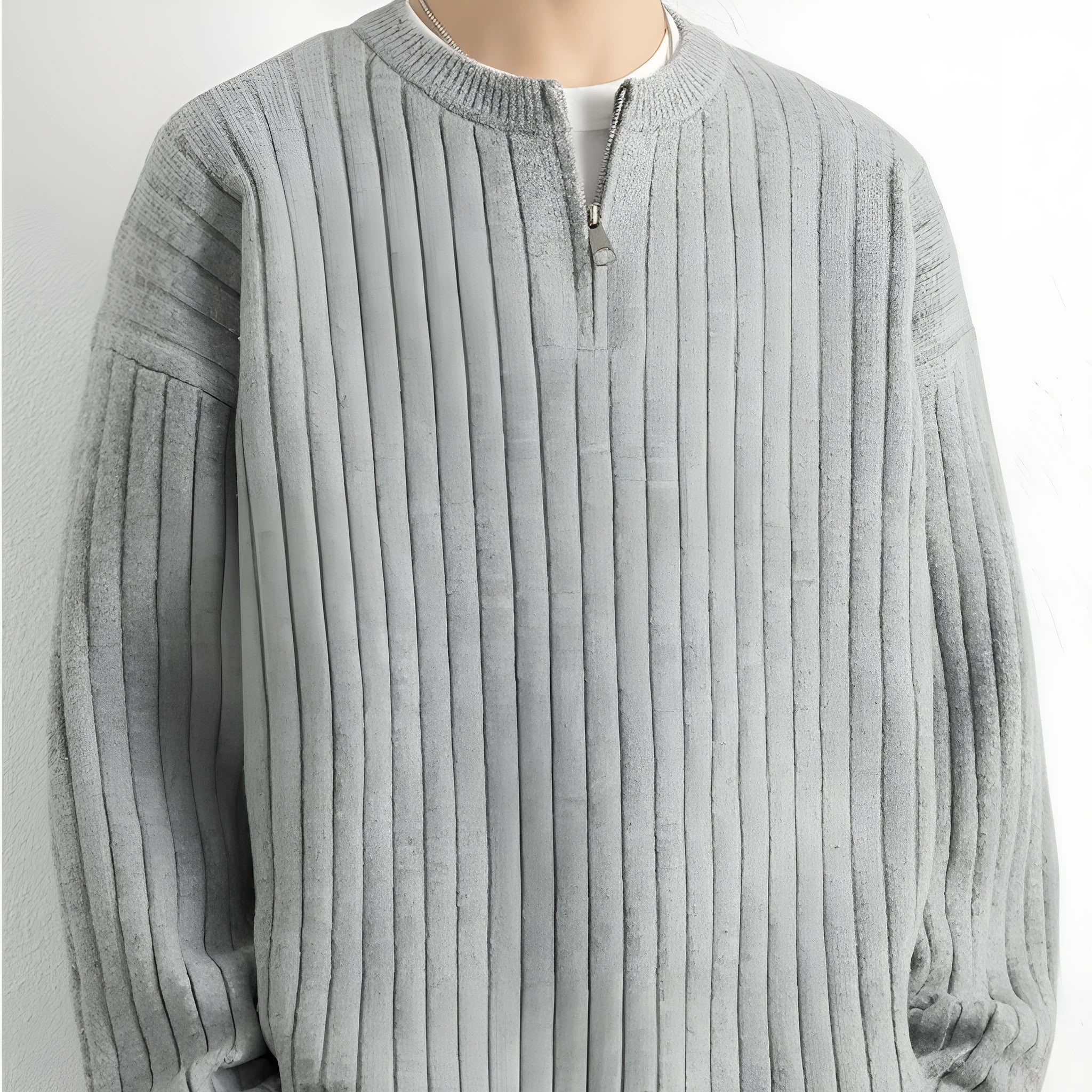Men's grey half-zip textured knit sweater showing loose fit and long sleeve design