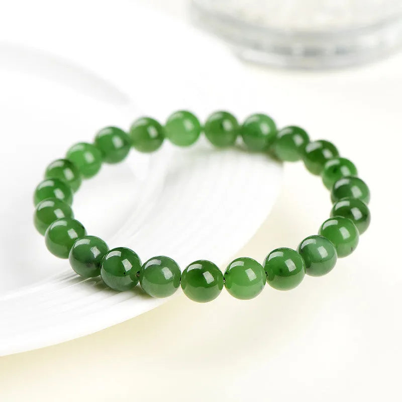 Natural Hetian jade jasper bead bracelet with polished finish showing earth-toned beads strung together