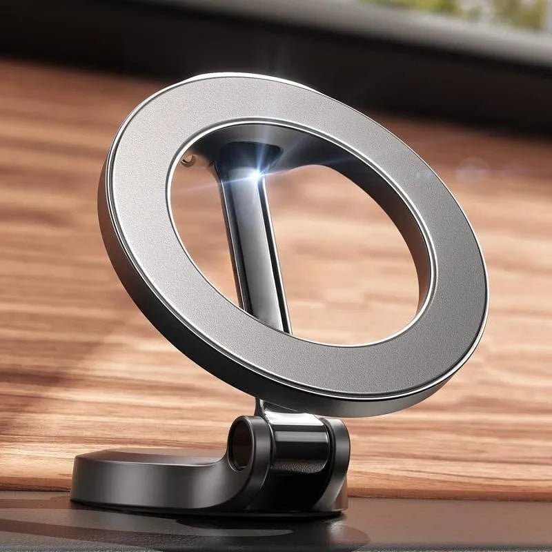 Foldable all-metal magnetic car phone mount in Qian colour on a car dashboard.