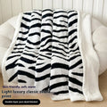 Double-layer leopard print jacquard taffeta blanket shown in camel zebra pattern