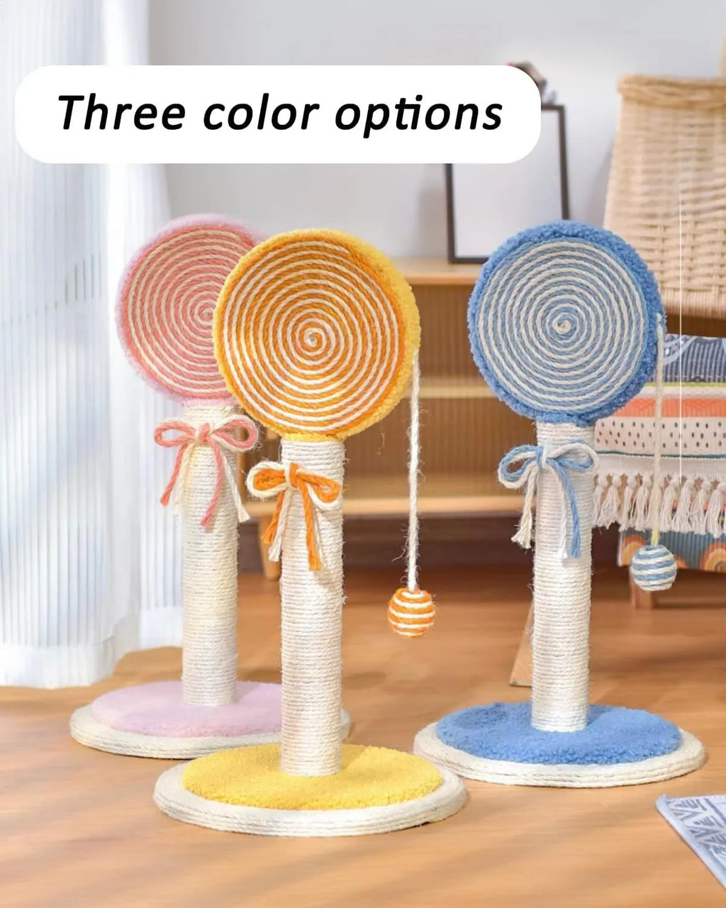 Blue cat scratching post with natural sisal rope and a hanging yellow ball toy on a wooden base.