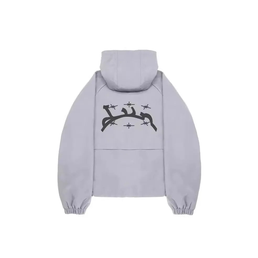 Grey loose fit men's hooded sunscreen jacket in British style on a middle-aged model.