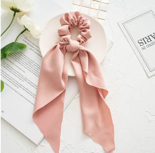 Cloth large intestine ring hair band in spring dark green ribbon colour, shown as a loop.