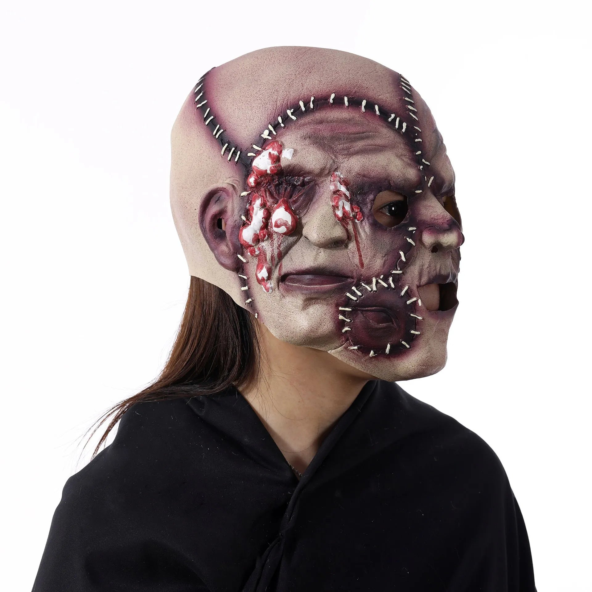 Three-sided grimace horror Halloween mask showing detailed latex texture and facial expression
