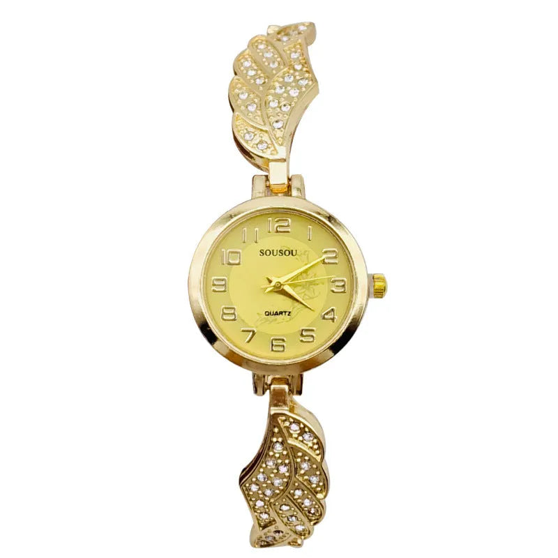 Stainless steel women's watch with round dial on wrist, showing Vachette clasp buckle