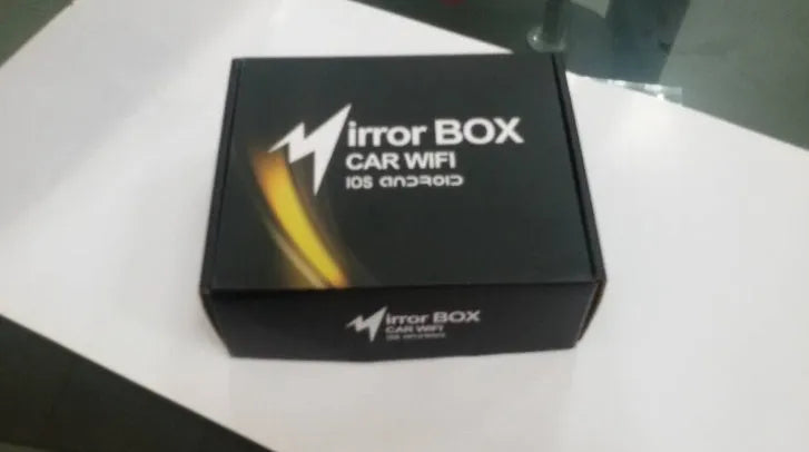 Black car Wi-Fi mirror converter box with cables for smartphone and tablet connectivity to vehicle entertainment systems
