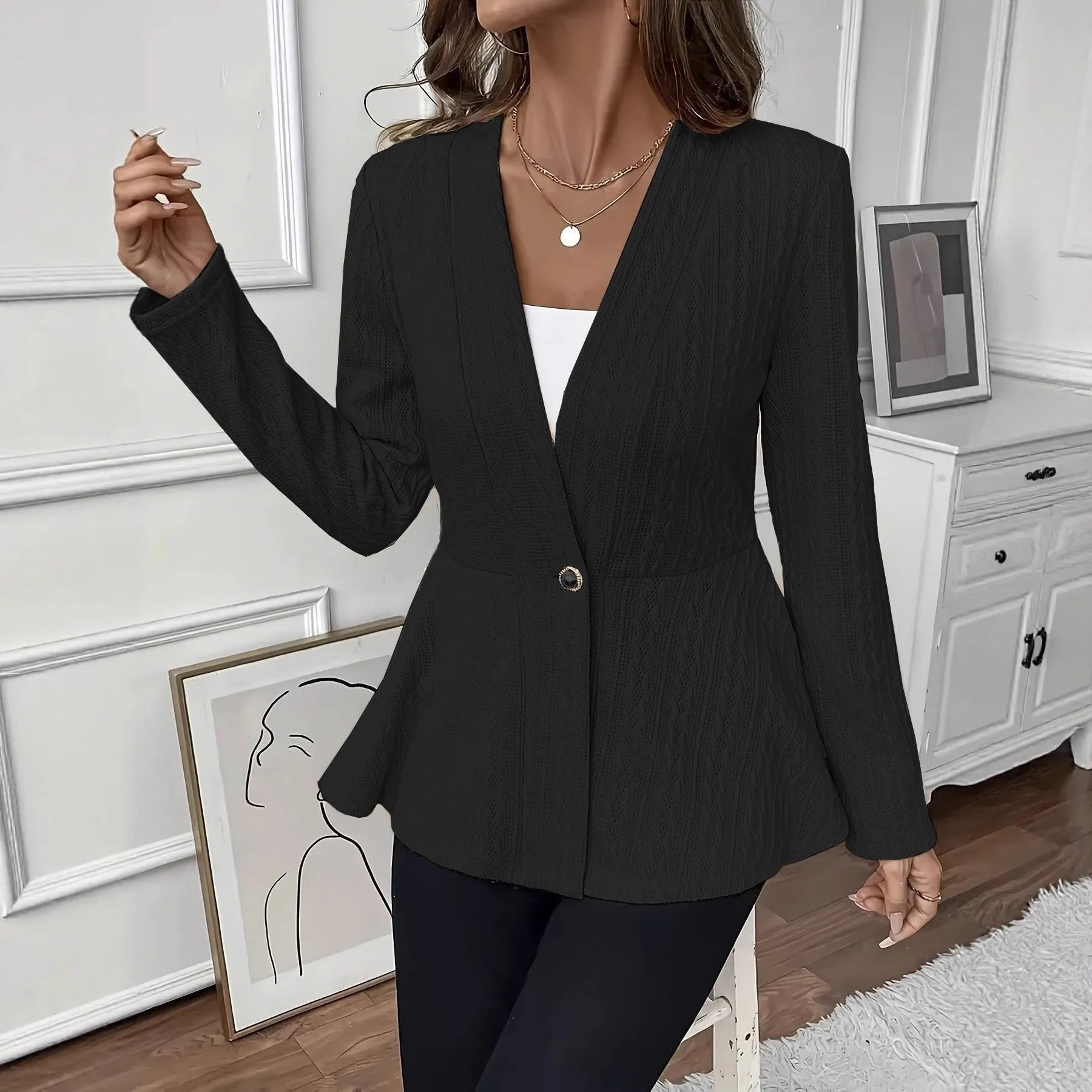 Women's apricot coloured Jacquard patterned knitted cardigan with one button front.