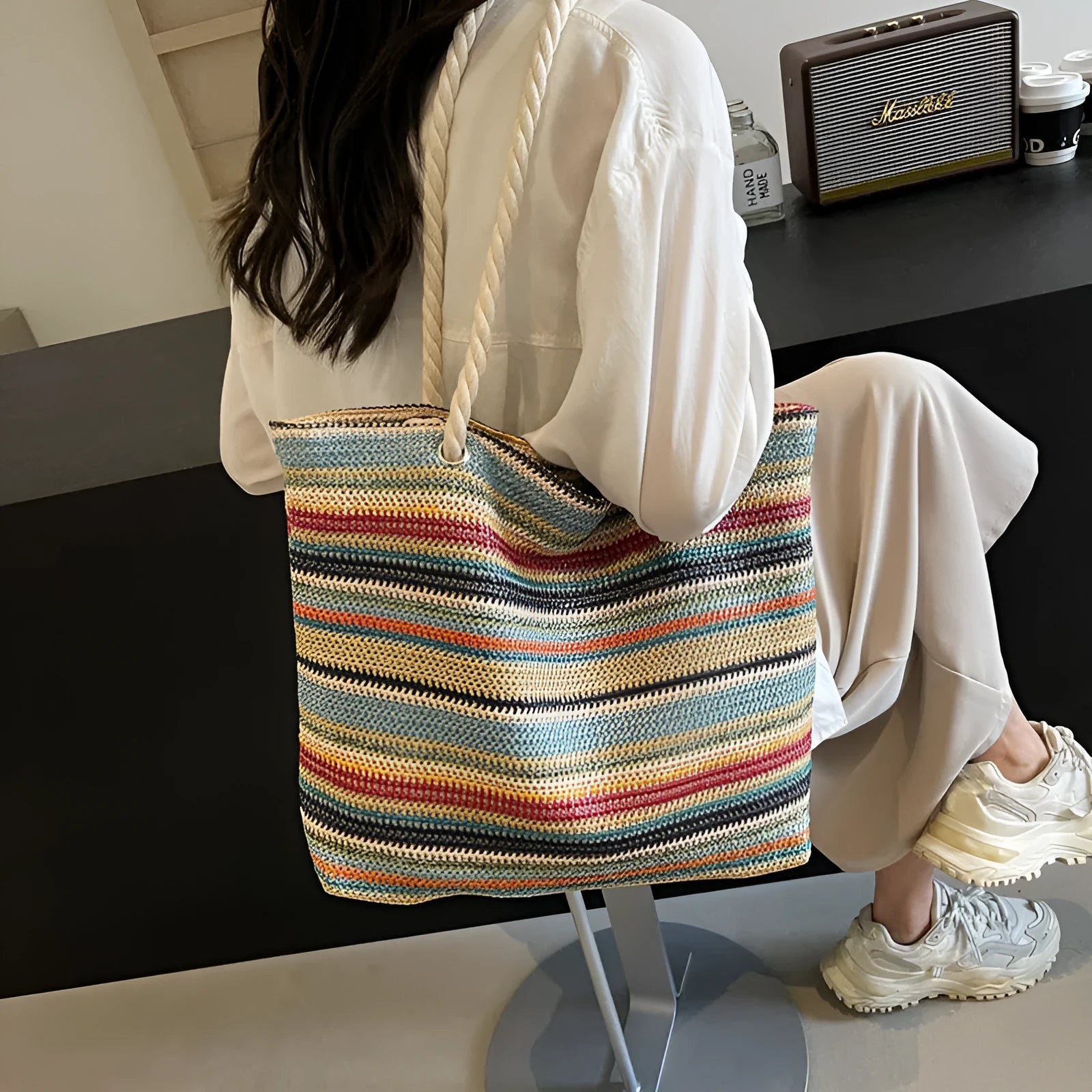 Blue woven nylon shoulder bag with large capacity and textured straw-like design