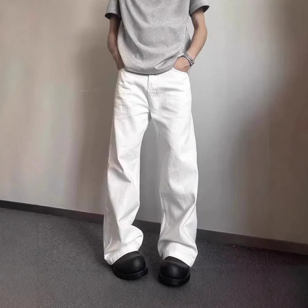 Men's straight-cut white wide-leg denim jeans with a mid waist and zipper fly