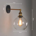 Retro round glass wall lamp with aluminium holder, shown in amber, smoky grey, and transparent finishes.