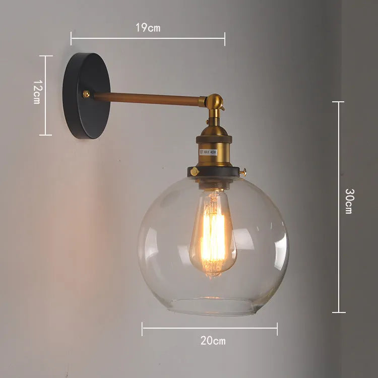 Retro round glass wall lamp with aluminium holder, shown in amber, smoky grey, and transparent finishes.