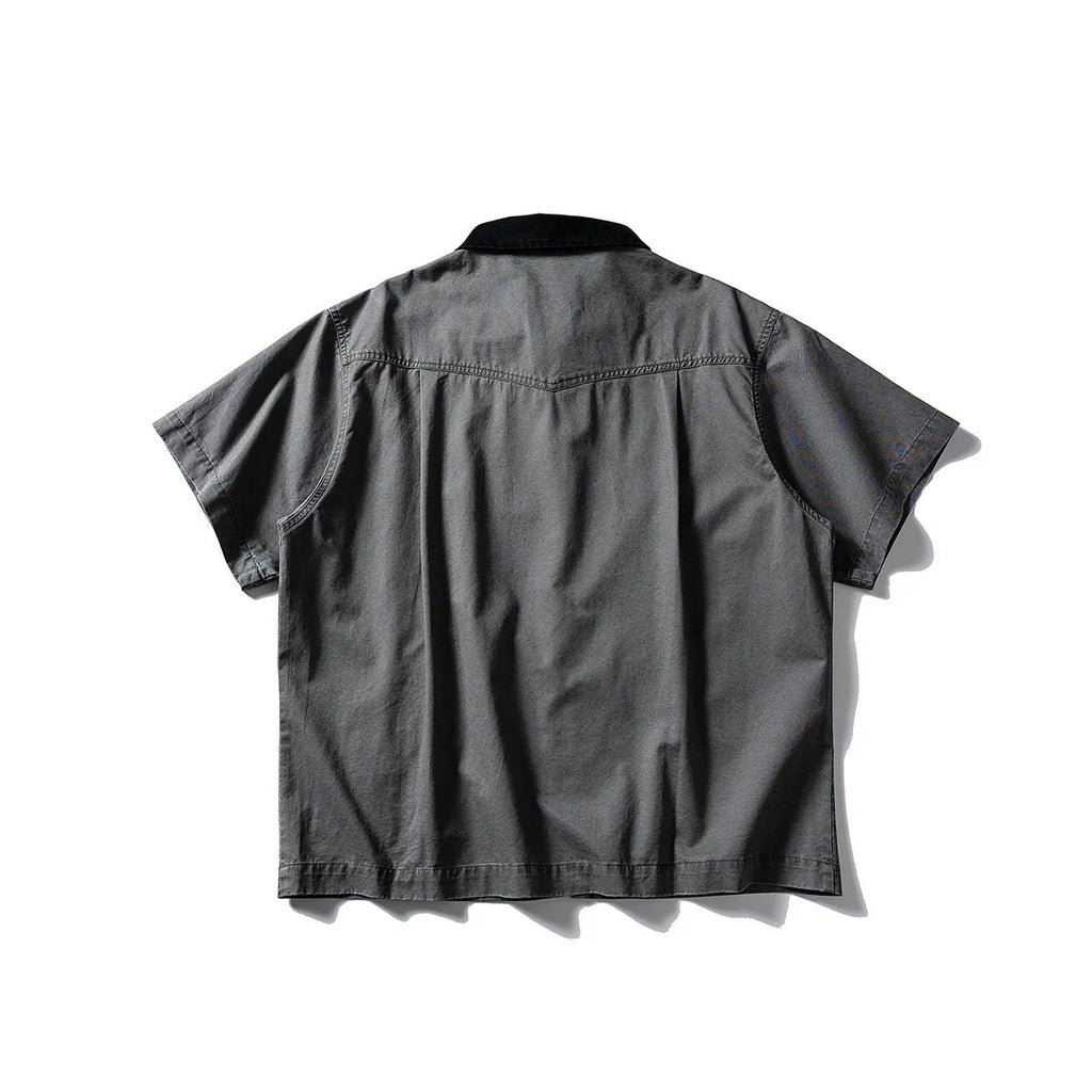 Teenager wearing a khaki loose-fit short sleeve cotton overalls shirt cardigan.
