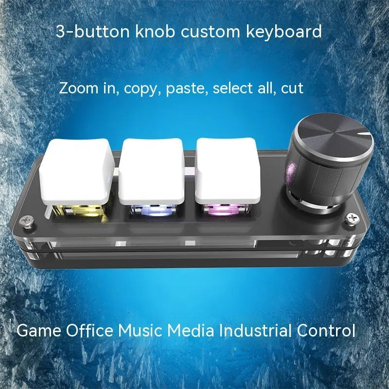 Compact black USB keypad with RGB colourful backlighting on a desk.