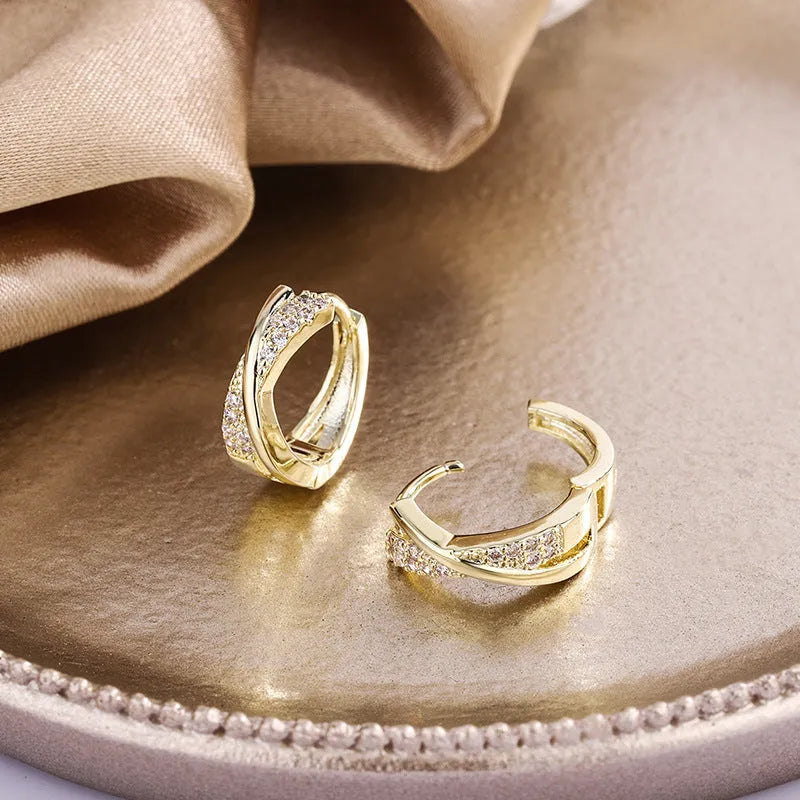 Geometric 14K yellow gold-plated earrings with zircon detailing on white background
