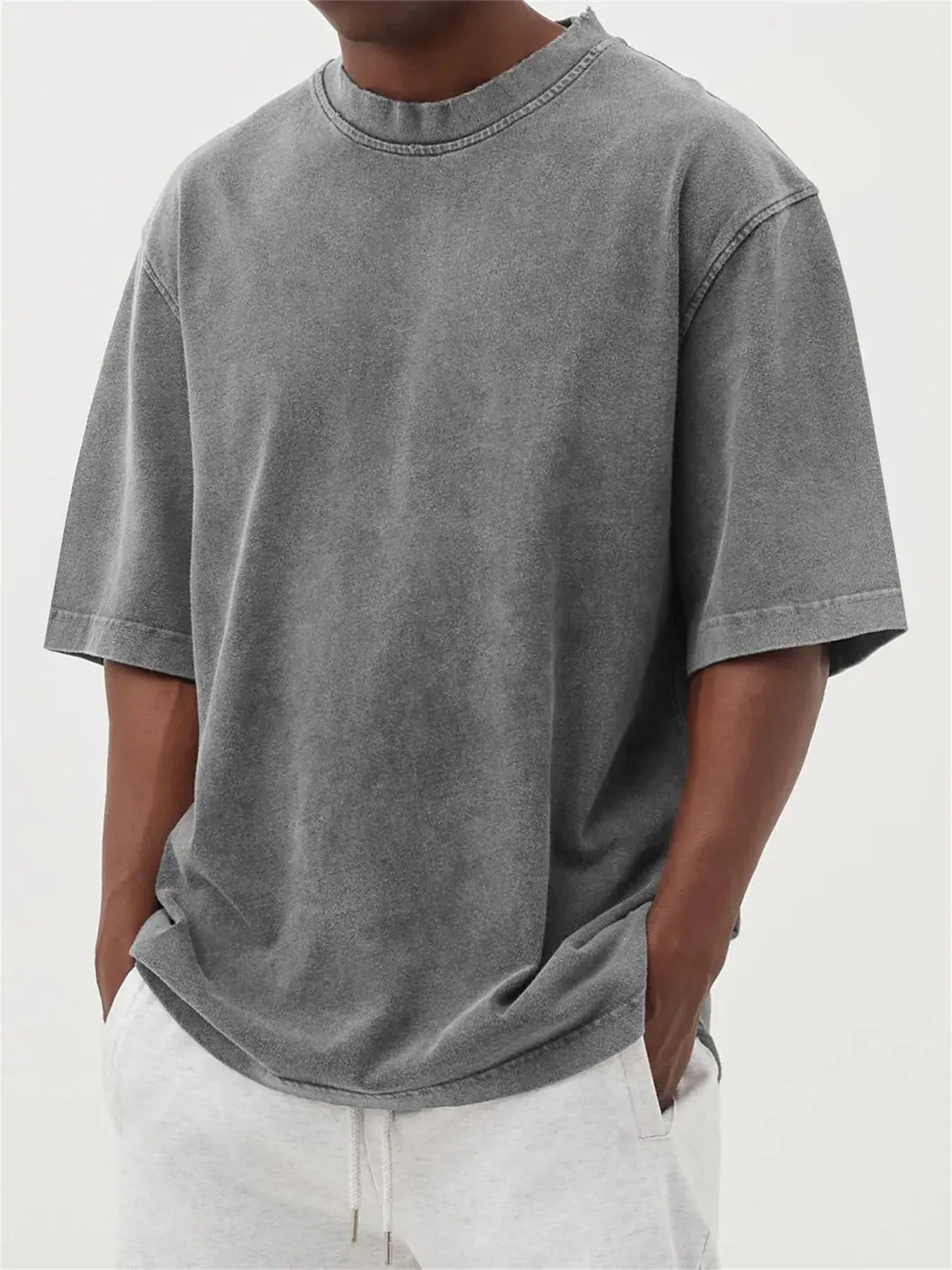 Men's stone washed distressed t-shirt in loose fit with half sleeves available in multiple colours