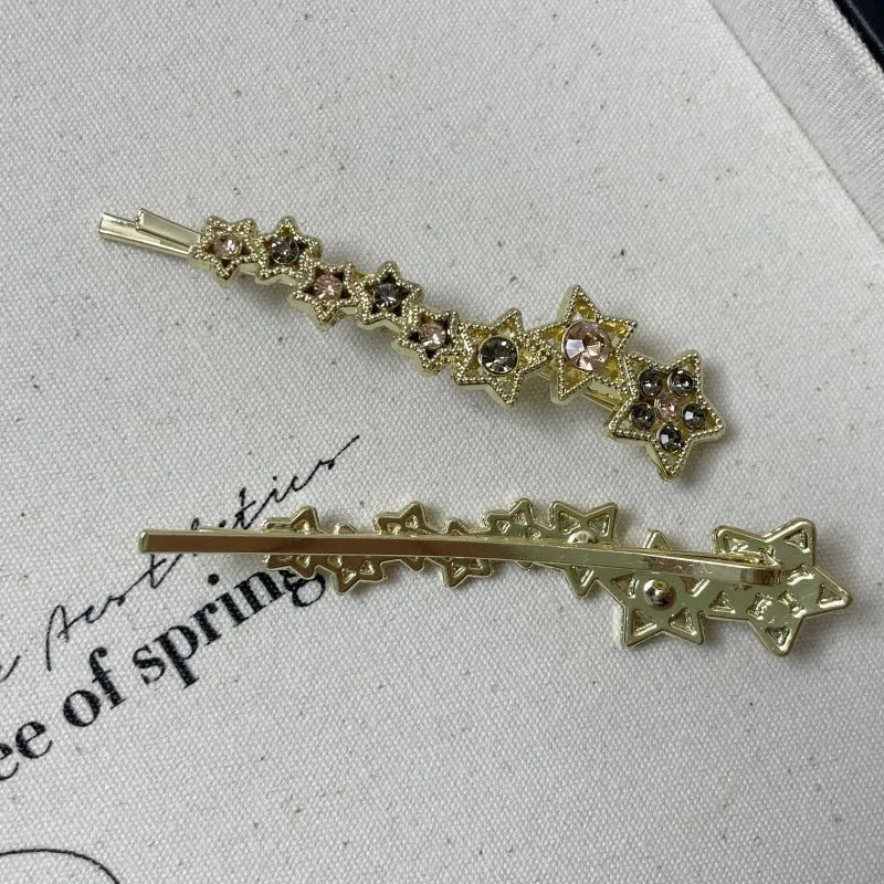 Korean style gold electroplated alloy hair barrette featuring a five-pointed star and word design.